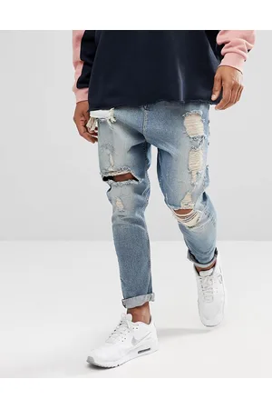 ASOS Drop crotch jeans in vintage light wash with heavy rips