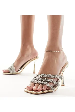 Simmi London SIMMI London Wide Fit - Messina - Guldfarvede mule-sandaler med hæl og udsmykkede stropper
