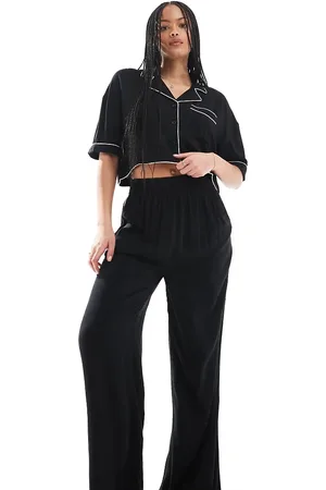ASOS ASOS DESIGN Tall - Sorte superbløde tætsiddende pyjamasbukser med vide ben og kontrasterende kantbånd