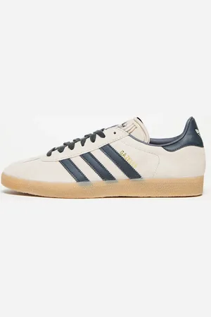 adidas Gazelle - Sneakers i gyldenbrun/indigoblå
