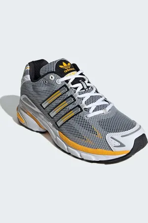 adidas Adistar - Hvide sko med stødabsorbering og sorte og gule detaljer