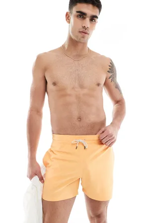 Ralph Lauren Traveler - Mellemlange slim-badeshorts i forvasket orange med ikonlogo