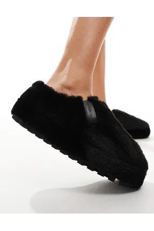 Calvin Klein Sorte mule-hjemmesko i imiteret pels