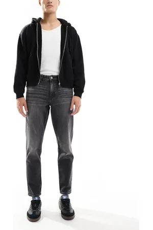 ASOS Tapered jeans i forvasket sort med stretch og vintage-toning