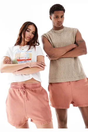 ASOS Unisex - Korte, smalle shorts i vasket pink-Lyserød