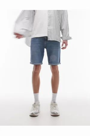 Tommy Hilfiger Scanton - Mellemblå og smalle samt forvaskede denimshorts med opsmøget kant