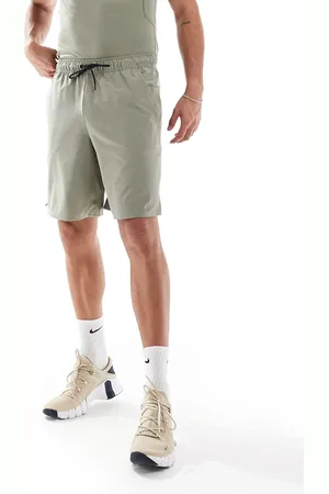 Nike Unlimited Dri-FIT - Lysegrønne og vævede 9-tommershorts