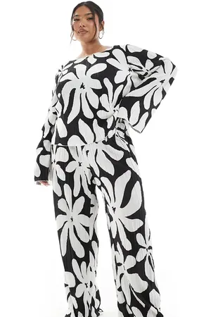 VERO MODA Monokrome bukser med høj talje, vide ben og plisseringer i blomstermønster-Sort