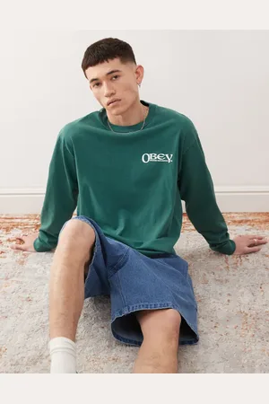 Obey Mørkegrøn og langærmet T-shirt med "Sensory Exploration"-grafik og logoprint på ryggen