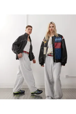 COLLUSION Unisex - Gråmelerede joggingbukser med vide ben og dobbelt linning