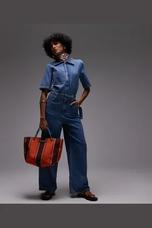 MANGO Lyseblå og oversized jumpsuit i denim med korte ærmer
