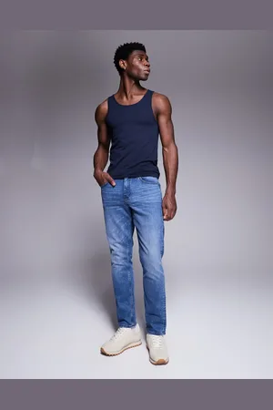 ASOS Mellemblå og smalle jeans i tonet vask