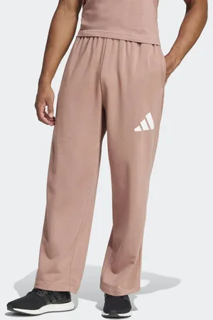 adidas Essentials - Lerfarvede bukser med vide ben og hvidt logo-Orange