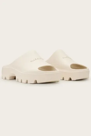 AllSaints Eclipse - Hvide flatform-sandaler i gummi