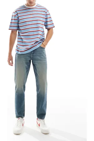 ASOS Mellemvasket blå tapered jeans med vintage-skær