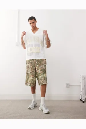 COLLUSION Afslappede skater-shorts i jersey med træcamouflage