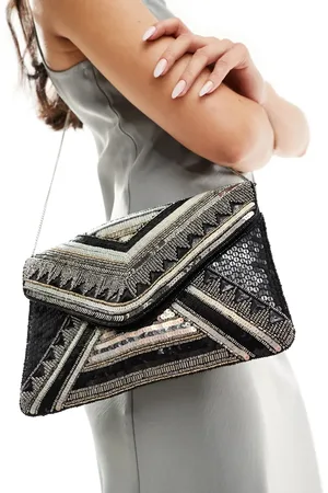 True Decadence Clutch-taske med kuvertlukning og perler i sort/guldfarve