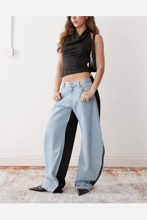 Lioness Jeans i blåt/sort kontrastdesign med hestesko-form og barrel-ben