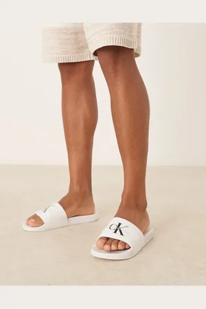 Calvin Klein Hvide og sorte sliders med monogram