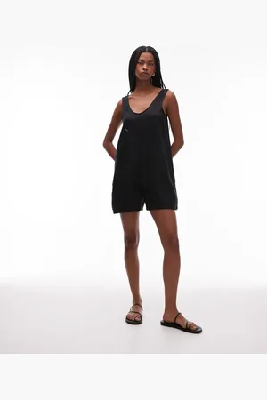 ARKET Strand-playsuit med dyb V-hals og lommedetalje i ren hør