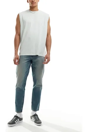 ASOS Tapered jeans i lys vask med tonet finish-Blå