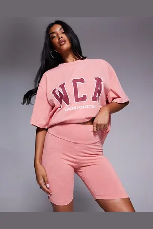 ASOS Weekend Collective - Forvaskede ferskenfarvede leggingshorts med college-grafik - Del af sæt-Orange