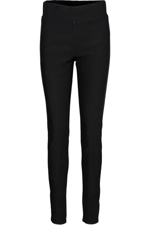 Freequent Close-Fitting Ankle-Length Pants With High, Elasticated Waist. Pockets At The Ba