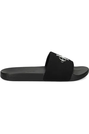 Calvin Klein Logo-embellished canvas slides