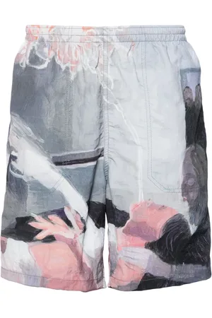 UNDERCOVER Paint-print crinkled track shorts