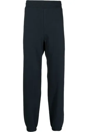 SUICOKE Logo-print cotton track pants