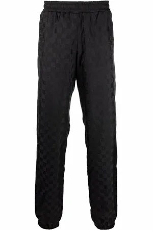 MISBHV Logo-monogram tapered joggers
