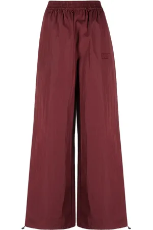 ROTATE Logo-embroidered elasticated-waist palazzo trousers