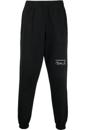 MARTINE ROSE Logo-print slim-fit track pants