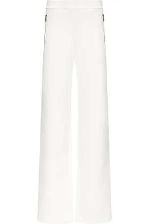 AREA Embossed handprint track pants
