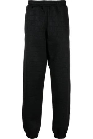 Moschino All-over logo-print track pants