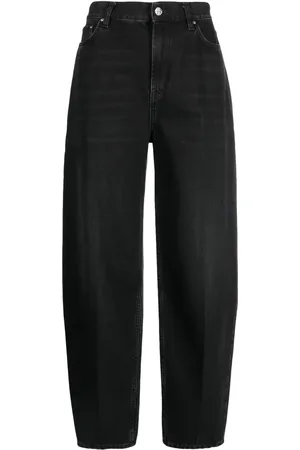 Totême Faded-effect tapered-leg jeans