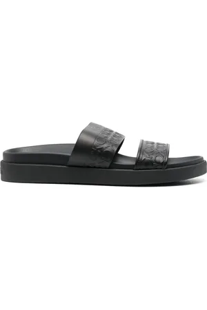 Calvin Klein Embossed-logo leather slides