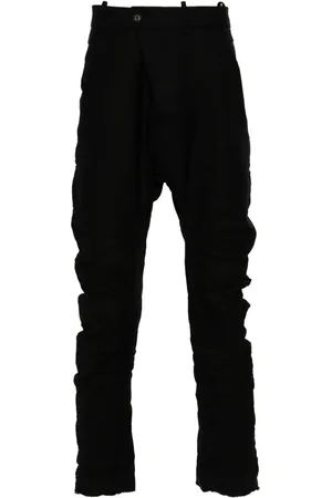 MASNADA Distressed-effect trousers