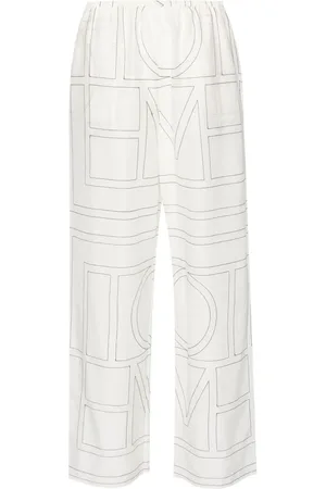 Totême Embroidered-monogram trousers