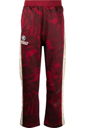 A Bathing Ape Graphic-print logo-patch trousers