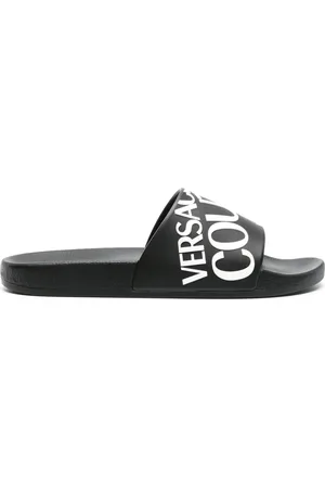 VERSACE Logo-embossed moulded-footbed slides