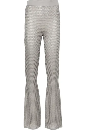 REMAIN Metallic striped flared trousers