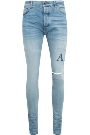 AMIRI Starburst Applique skinny jeans