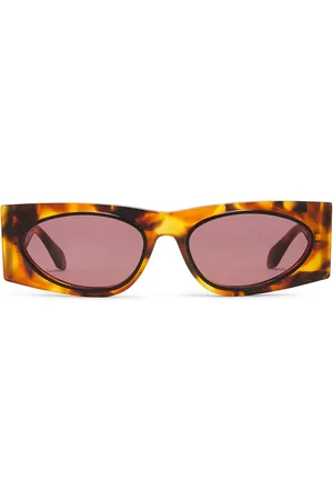 Alaïa Oval Transparent Sunglasses in