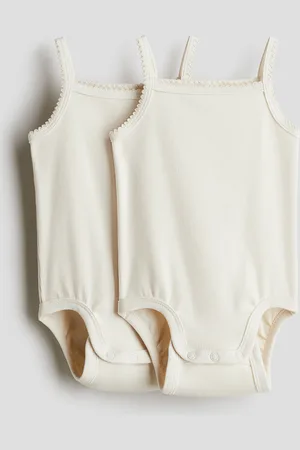 H&M 2 kpl pimapuuvillatrikoisia bodyja