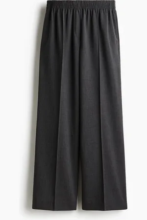 H&M Väljät prässilahkeiset housut