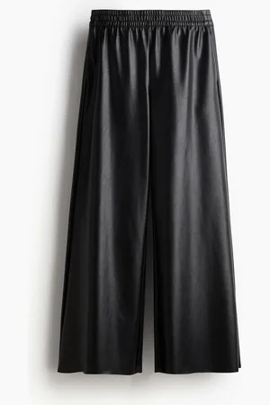 H&M Väljät pinnoitetut joggersit