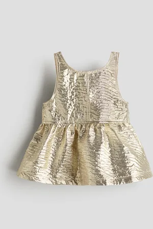 H&M Kimmeltävä peplum-toppi