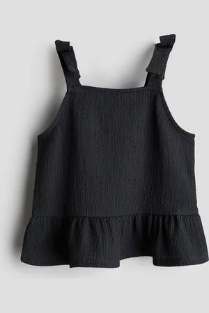 H&M Rusettikoristeinen peplum-toppi