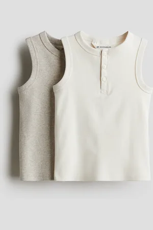 H&M 2 kpl ribattuja puuvillatoppeja